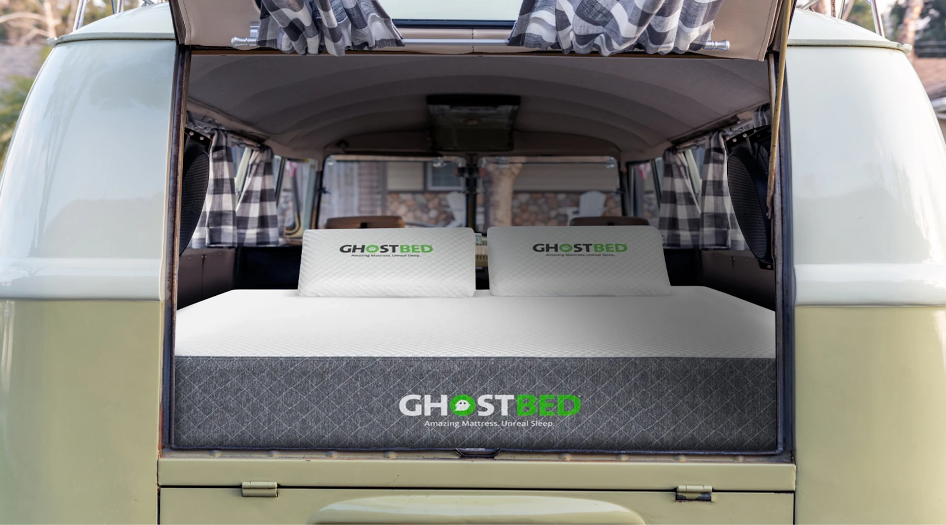 A GhostBed Short Queen RV mattress in the back of a converted van.