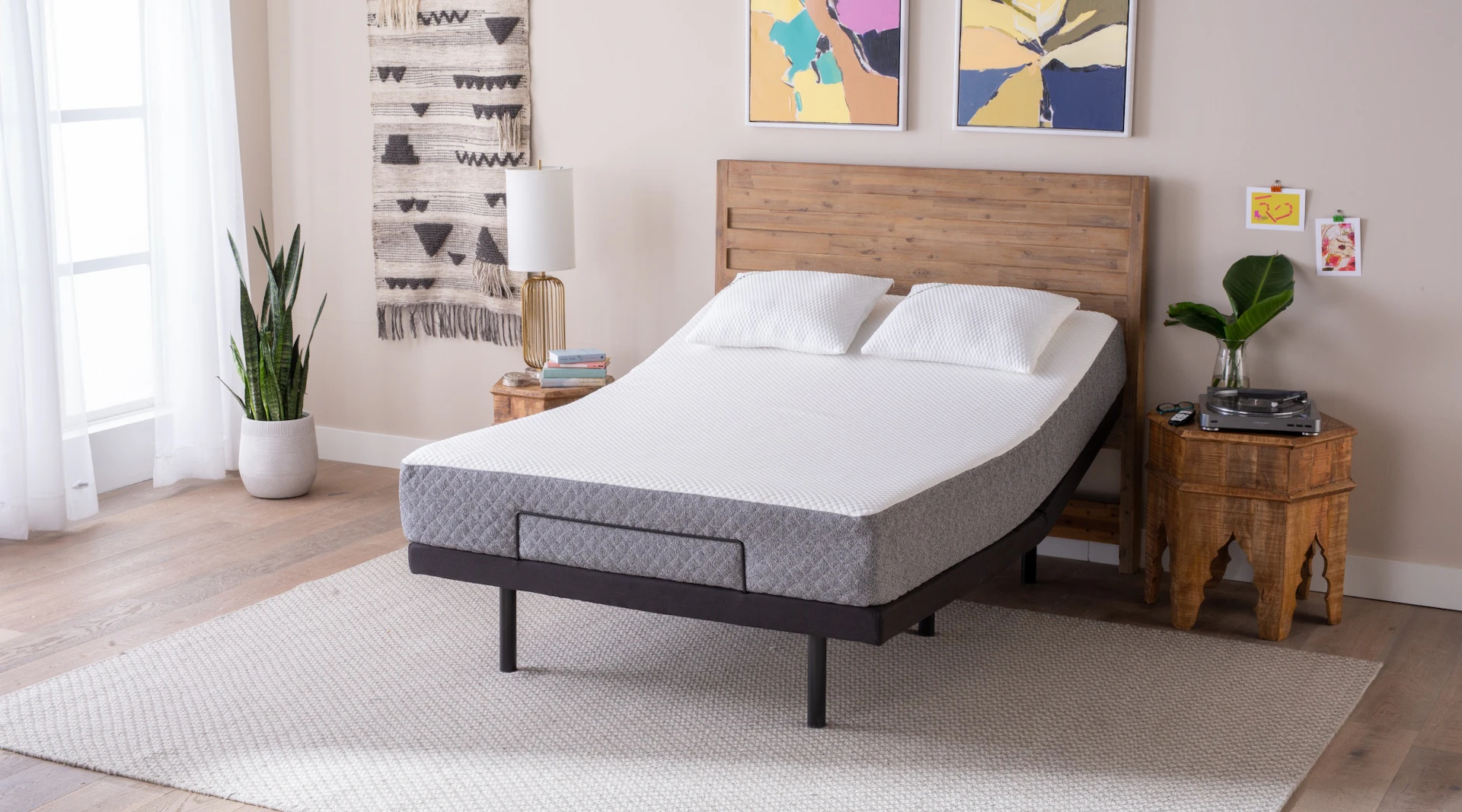 GhostBed Adjustable Base paired with a large headboard.