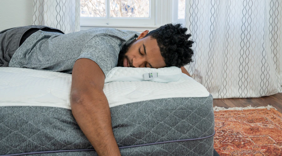 A man tries to sleep while sick