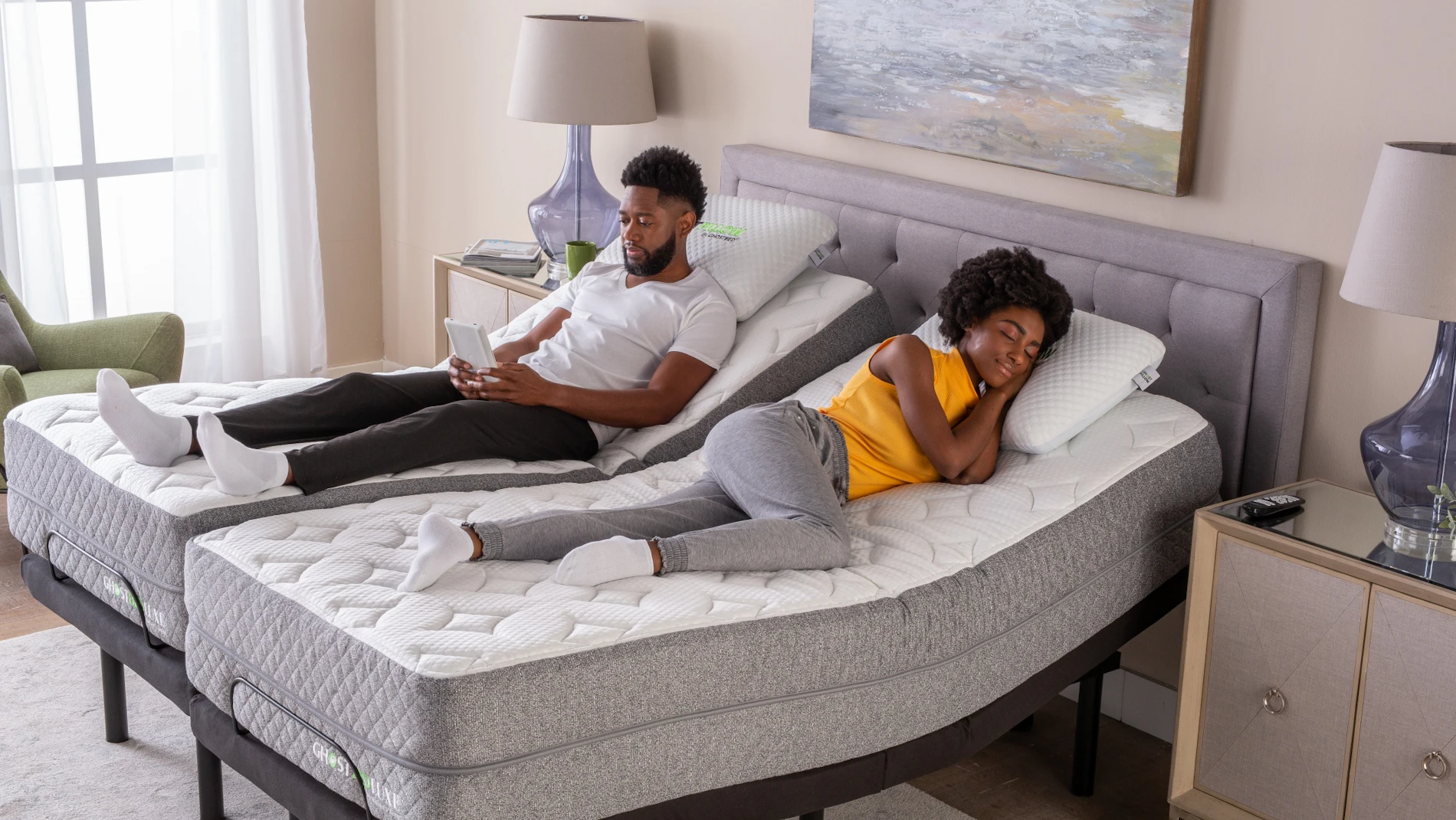 A couple rests on their GhostBed Split King Mattress