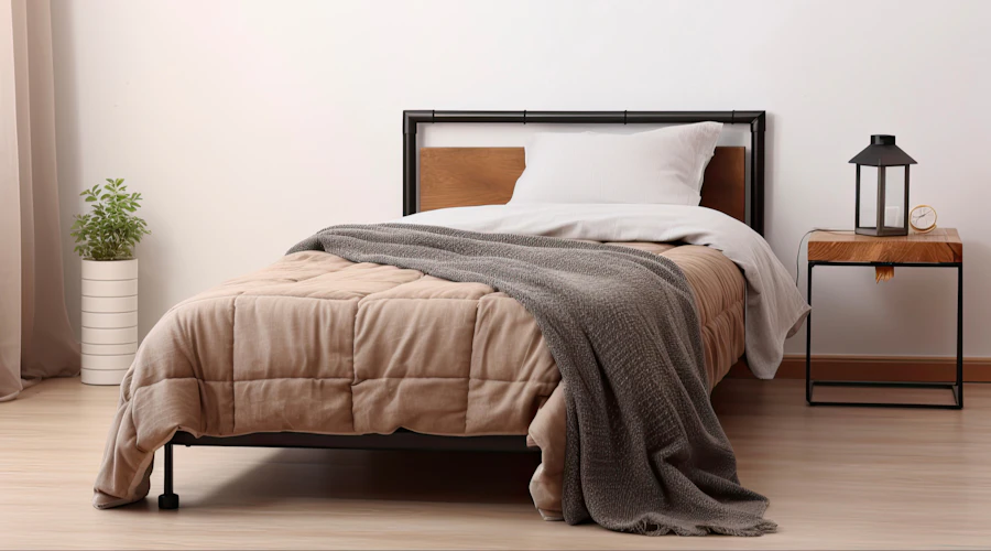 Twin-sized mattress with bedding.