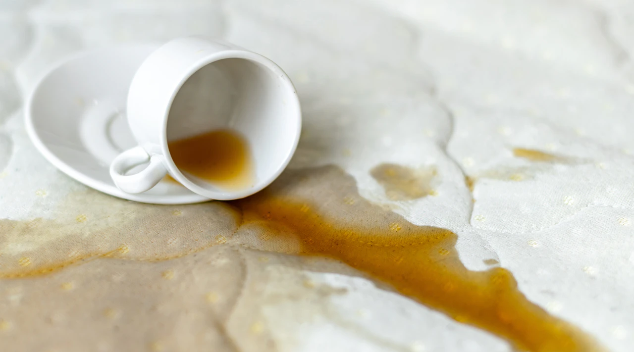 Coffee spill causing water damage on a mattress
